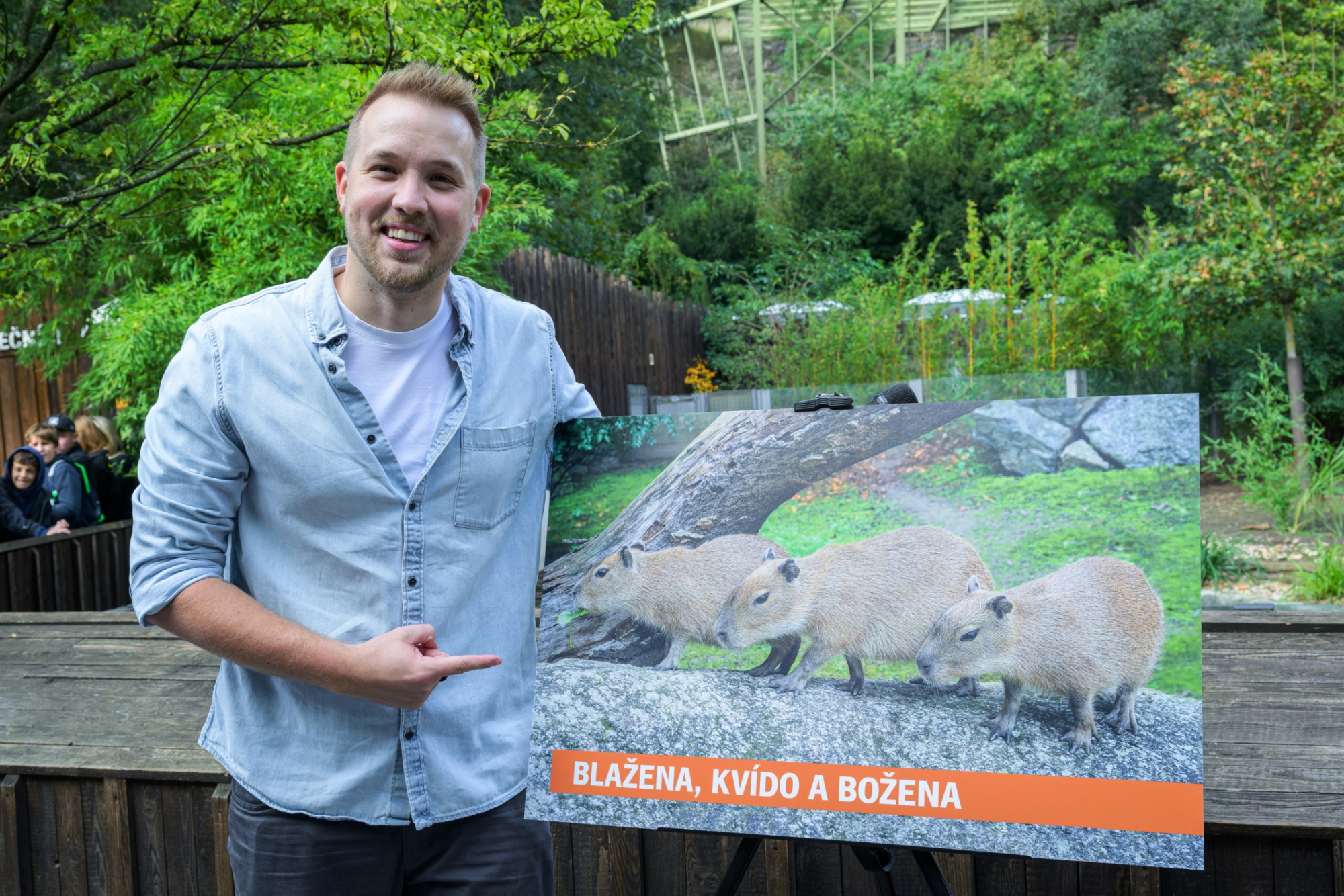 Influencer Jiří Král introducing his godchildren - capybara triplets Blažena, Božena and Kvído. Photo Petr Hamerník, Prague Zoo